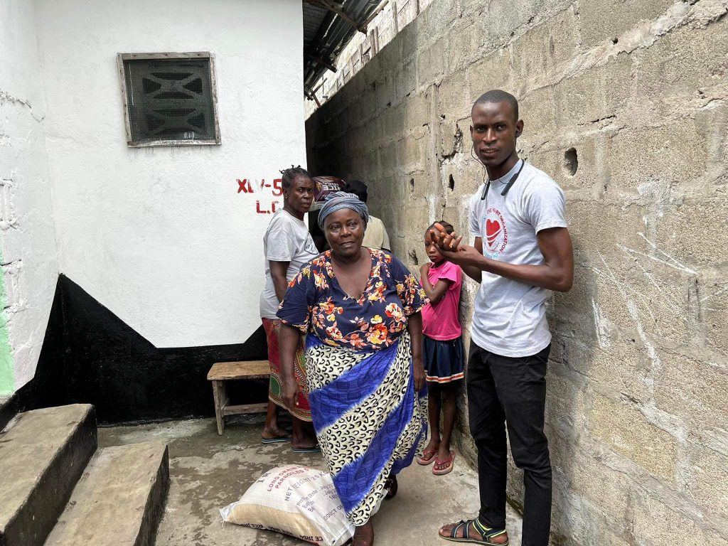 Old Women Getting Bag of Rice